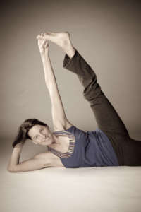 Side lying with hip externally rotated. Natasha demonstrates "yogi toe hold". No need for strap!